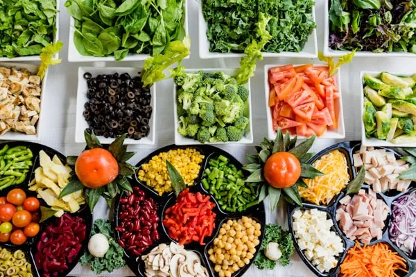 Fresh fruits and vegetables on a cutting board